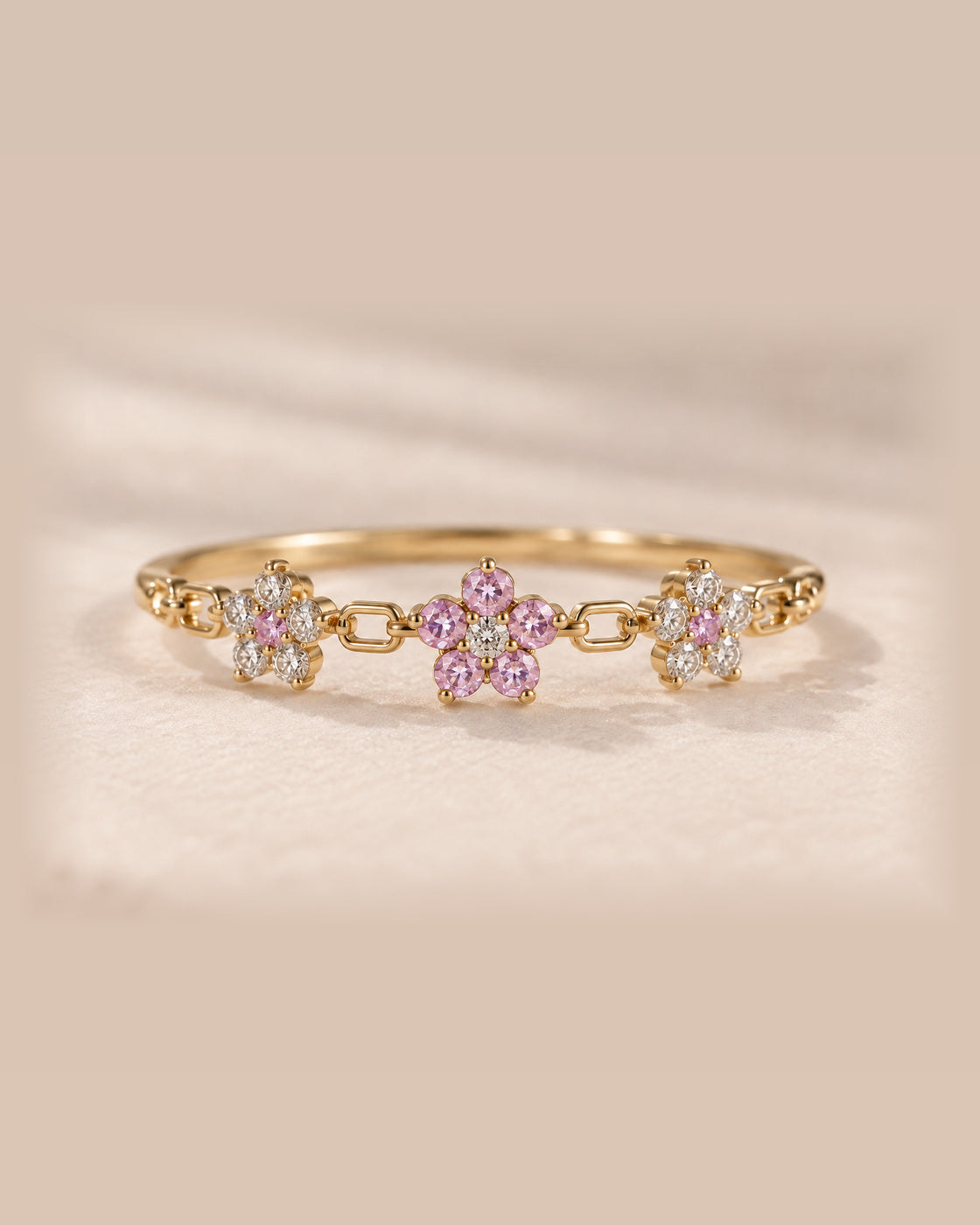EVELYNNIE Floral Garland Ring in 18K yellow gold with pale pink sapphires and natural diamonds, corrected front view