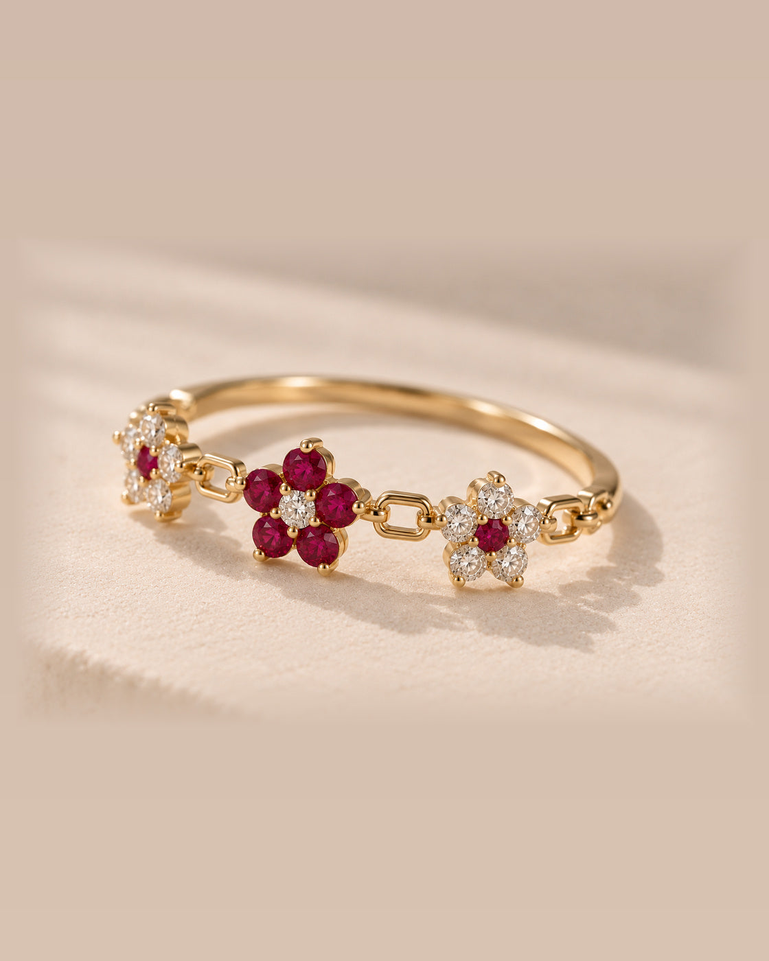 EVELYNNIE Floral Garland Ring with rubies and natural diamonds in 18K yellow gold, three-quarter view
