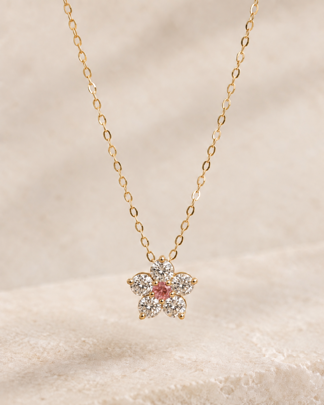 EVELYNNIE Floral Pendant Necklace in 18K yellow gold with pale pink sapphire center and natural diamond petals, front view
