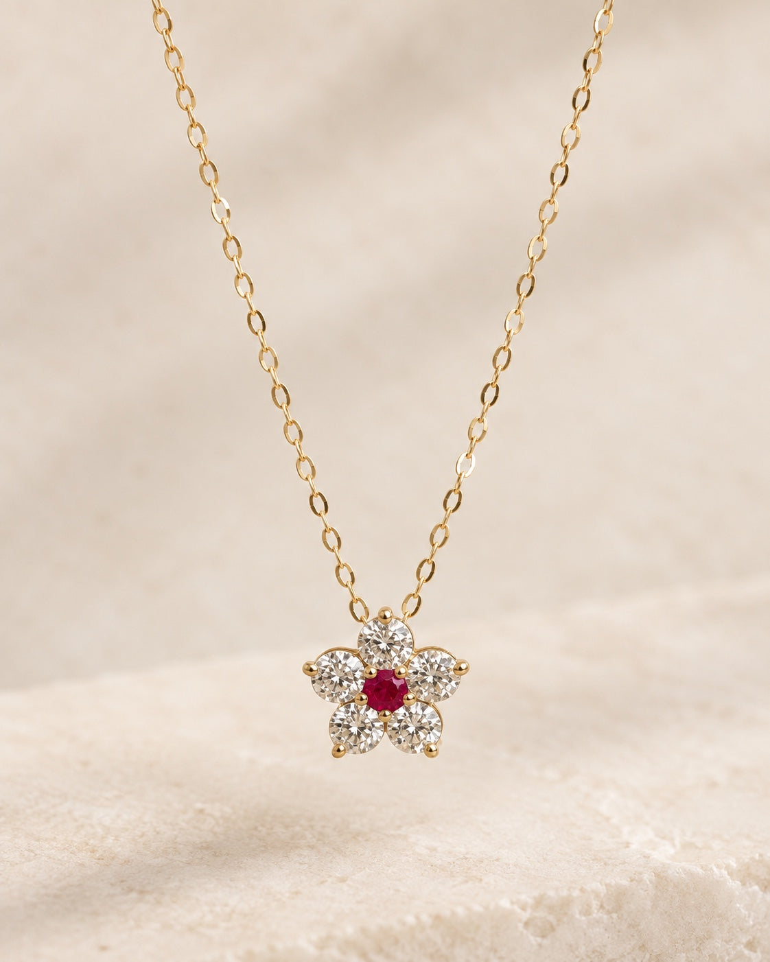 EVELYNNIE Floral Pendant Necklace in 18K yellow gold with ruby center and natural diamond petals, front view